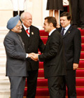 President Sarkozy welcoming Prime Minister Dr Manmohan Singh with Messrs Barroso and Jean Claude Gaudin, senator and mayor of Marseille